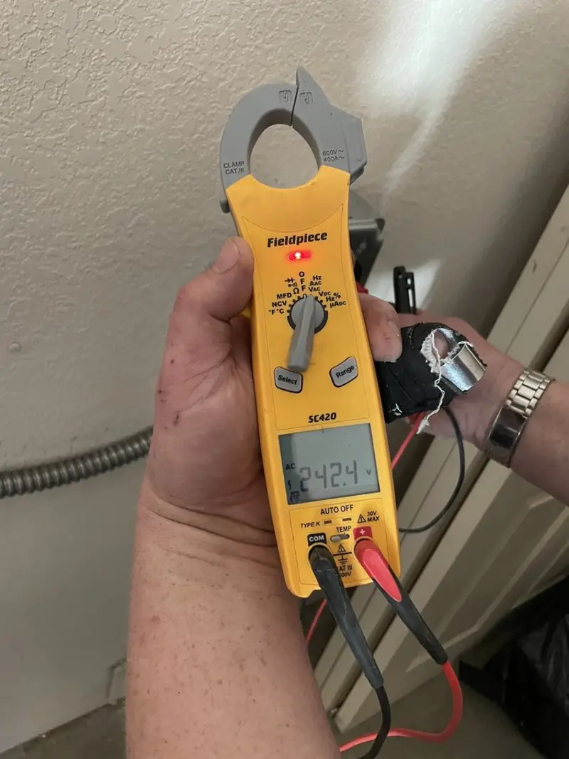 Voltage testing with clamp meter during Recessed Lighting Installation in Hereford